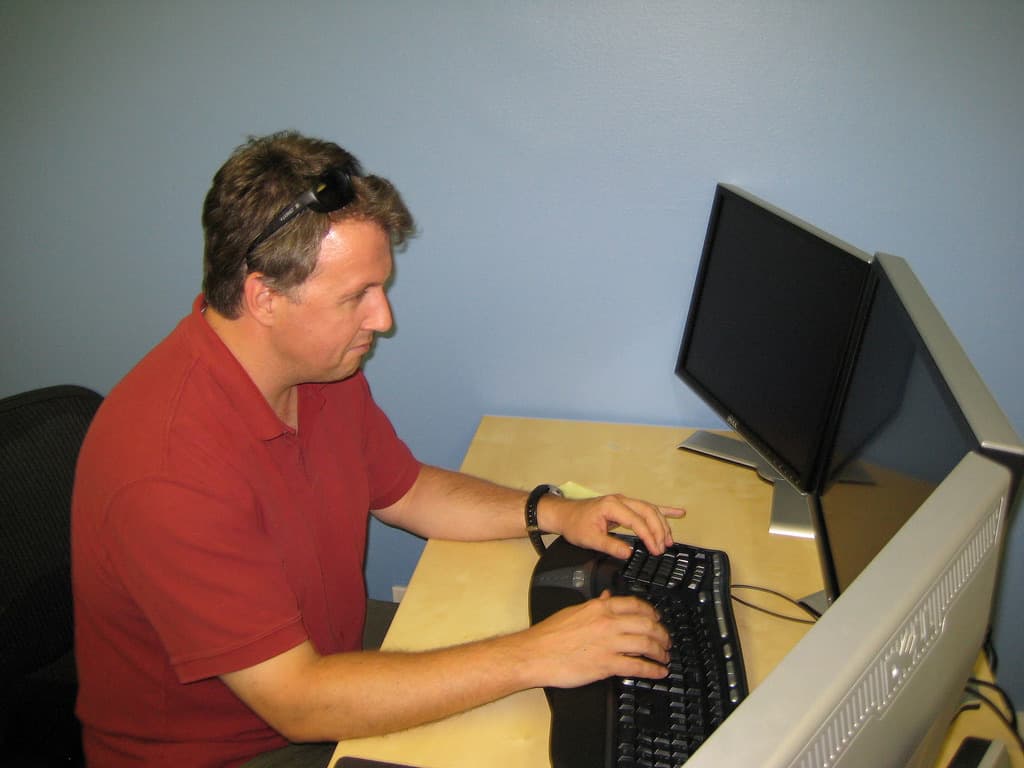 Paul Graham at a desk, photographed by Gabor Cselle in 2007